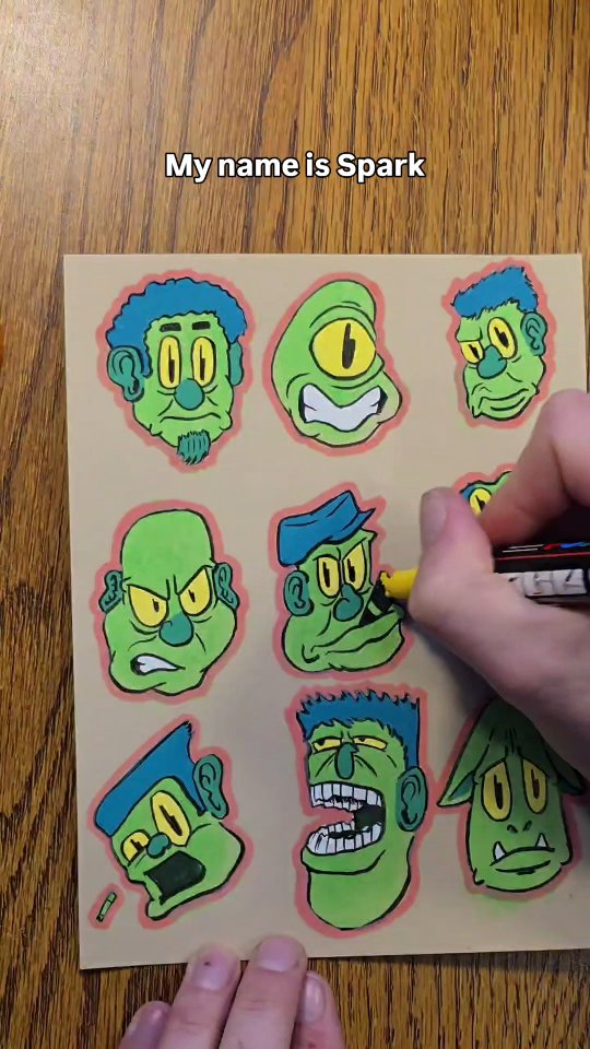 Nine green goblin and monster faces with blue hair and yellow eyes on a tan background, one wearing a backwards cap.
