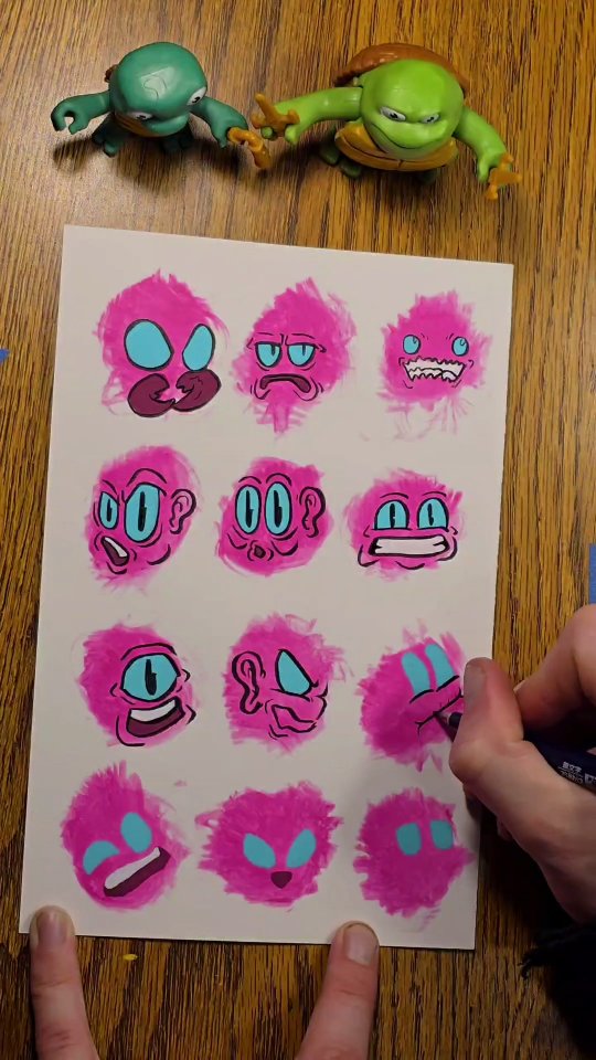 Twelve scruffy hot-pink blob creatures with teal eyes painted loosely on white paper.